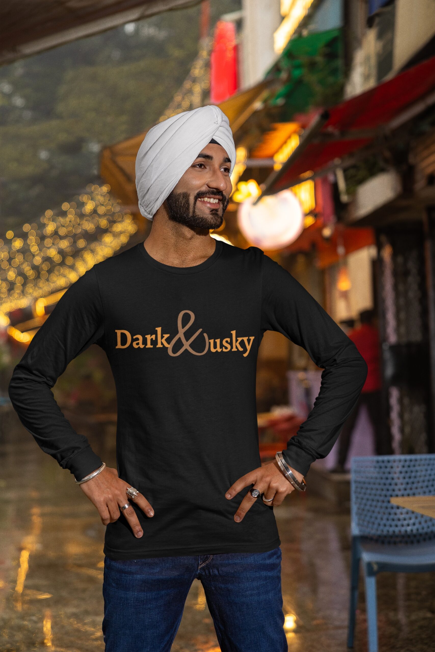 bella-canvas-long-sleeve-tee-of-a-happy-man-with-a-turban-posing-by-a-food-district-m38609 (1)